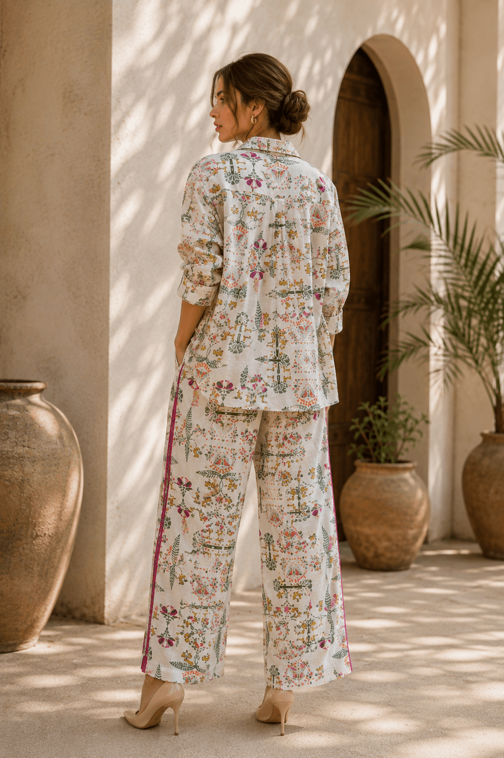 Back view of a Sundarban print shirt and magenta-striped trousers.